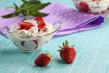 strawberries with cream in a bowl of glass