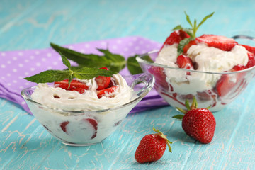 strawberries with cream in a bowl of glass