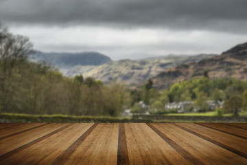 Lake District landscape with stormy sky over countryside anf fie