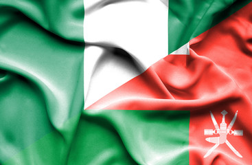 Waving flag of Oman and Nigeria