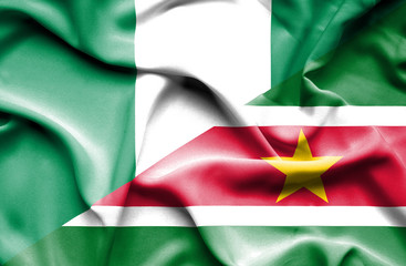 Waving flag of Suriname and Nigeria