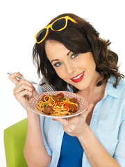 Beautiful Attractive Young Woman Holding a Plate of Spaghetti and Meatballs