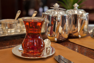 traditional Turkish tea in a thin-waisted glass, tea time in a luxury hotel, Istanbul, Turkey