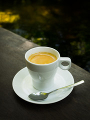 cup of coffee espresso on the wood desk