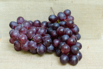bunch of ripe grapes on sackcloth