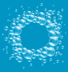 Transparent soap bubbles like frame on blue background