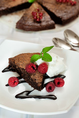 Chocolate brownie with raspberry and mint