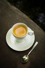 cup of coffee espresso on the wood desk