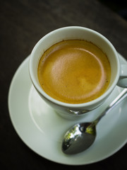 cup of coffee espresso on the wood desk