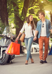 Fototapeta premium Young tourists in shopping tour