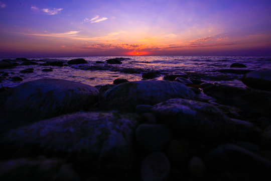 Amazing sunset on the pebble beach