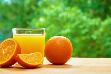 Orange and glass on the table