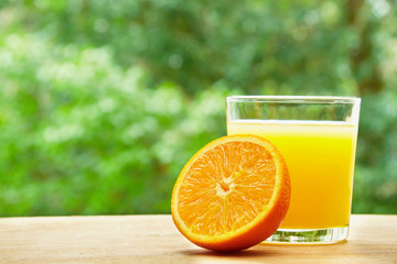Orange and glass on the table
