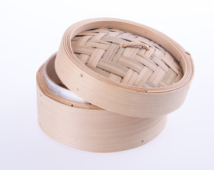 Bamboo steamer or dim sum steamer on background.