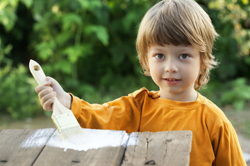 happy boy with paint brush