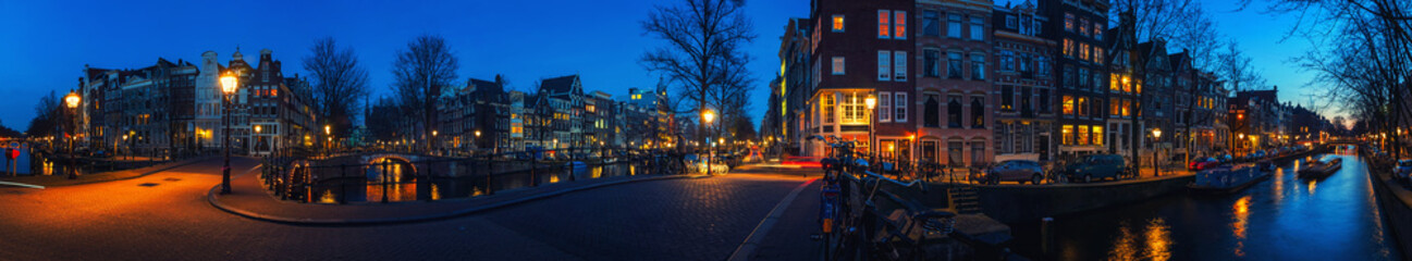 Fototapeta premium Amsterdam, Netherlands canals and bridges at night