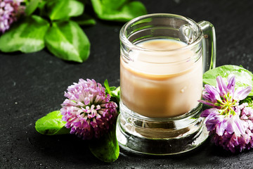 Irish liqueur and clover, selective focus