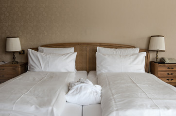 Fototapeta na wymiar Bed in a hotel room