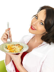 Beautiful Young Woman Holding a Plate of Cannelloni Pasta