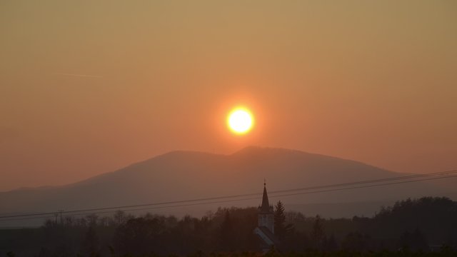 Sunset over the village time lapse