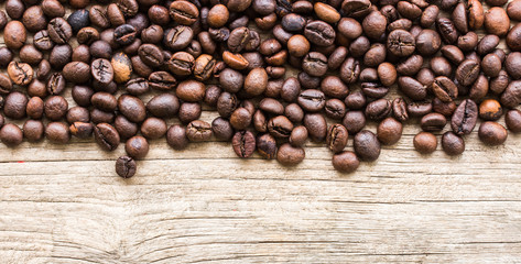Background with coffee beans and wood texture
