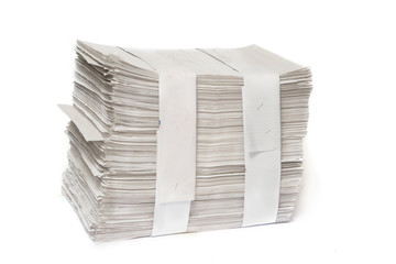 close up of stack of papers on white background