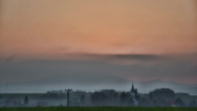 Sunset over the village time lapse