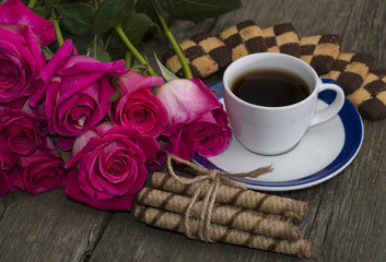 coffee with cookies and union of scarlet roses
