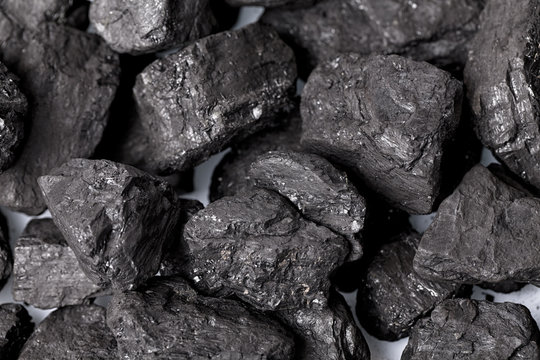 Lumps of black coal in focus as a background