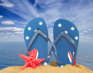green sandals and starfish in sand