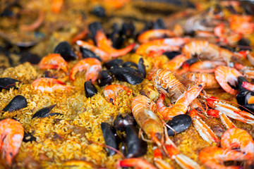 Traditional paella with seafood in a market