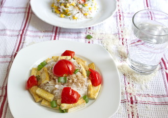 basmati rice served with tofu pieces, tomatoes and onion
