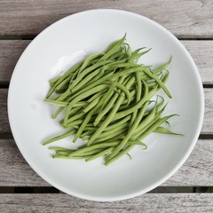 Plate of French green beans freshly picked from the vegetable garden