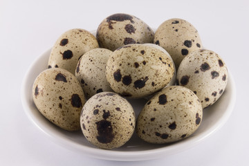 Quail eggs on a saucer