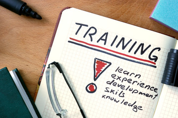 Notepad with Training on office wooden table.