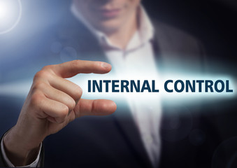 Businessman presses button internal control on virtual screens.