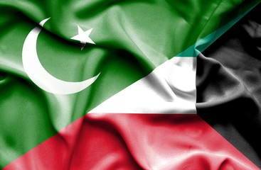 Waving flag of Kuwait and Pakistan