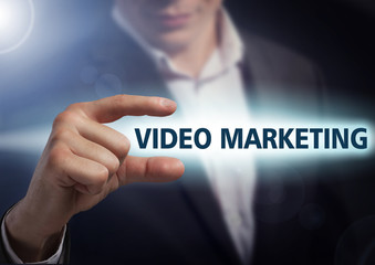 Businessman presses button video marketing on virtual screens. B