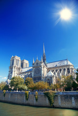 Fototapeta na wymiar Notre Dame cathedral with puffy clouds, Paris, France