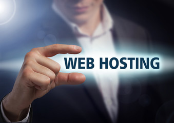 Businessman presses button web hosting on virtual screens. Busin