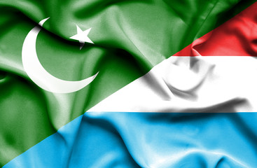 Waving flag of Luxembourg and Pakistan