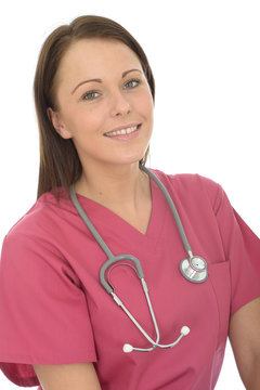Portrait Of A Beautiful Young Female Doctor Smiling And Wearing Scrubs