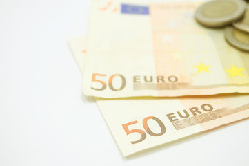 Euro banknote with coins