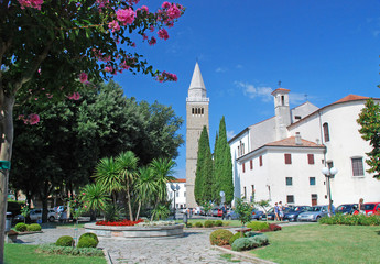 Place in city of Koper with its cathedral and bell tower in the background, Slovenia - obrazy, fototapety, plakaty