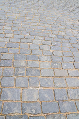 The road is paved with large stone