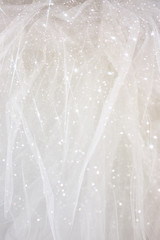 Vintage tulle chiffon texture background with glitter overlay
