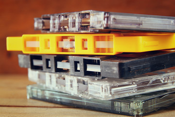 close up photo of stack of Cassette tapes over wooden table

