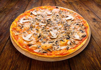 Delicious pizza with mushrooms and smoked chicken