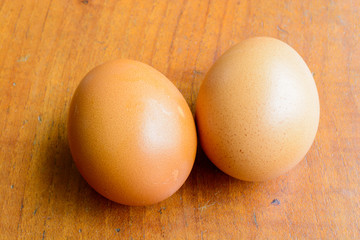 Eggs on wooden table background