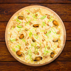 Delicious seafood pizza with olives